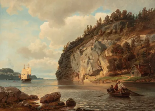 Kystlandskap med fiskere som trekker garn